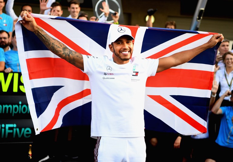 2018 F1 World Drivers Champion Lewis Hamilton of Great Britain and Mercedes GP celebrates with his team after the Formula One Grand Prix of Mexico at Autodromo Hermanos Rodriguez on October 28, 2018 in Mexico City, Mexico. PHOTO/AFP