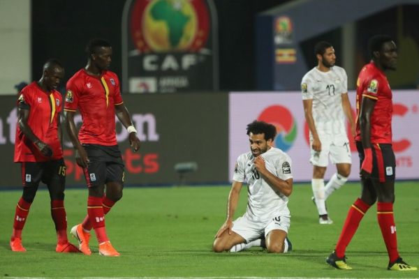 30 June 2019, Egypt, Cairo: Egypt's Mohamed Salah kneels on the pitch during the 2019 Africa Cup of Nations Group A soccer match between Egypt and Uganda at Cairo International Stadium. PHOTO | AFP