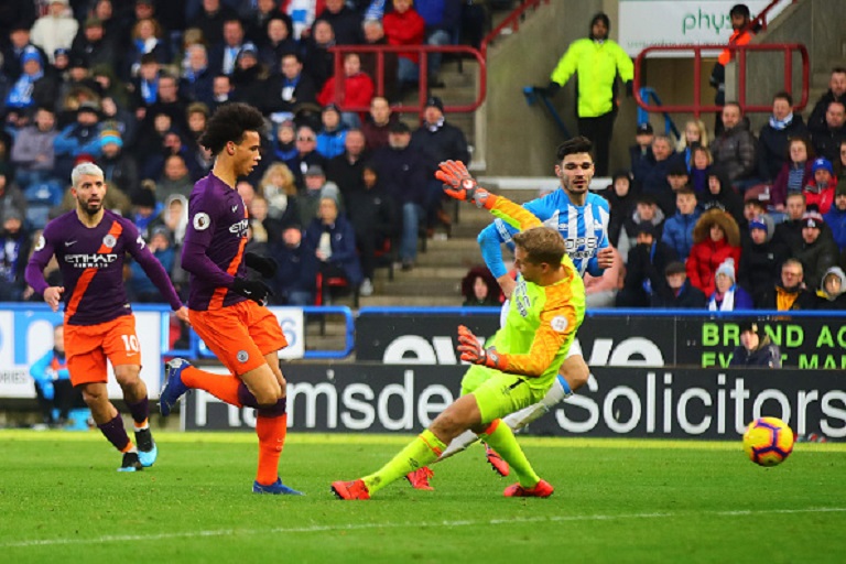 Leroy Sane of Manchester City scores his side's third goal during the Premier League match between Huddersfield Town and Manchester City at John Smith's Stadium on January 20, 2019 in Huddersfield, United Kingdom.PHOTO/GETTY IMAGES