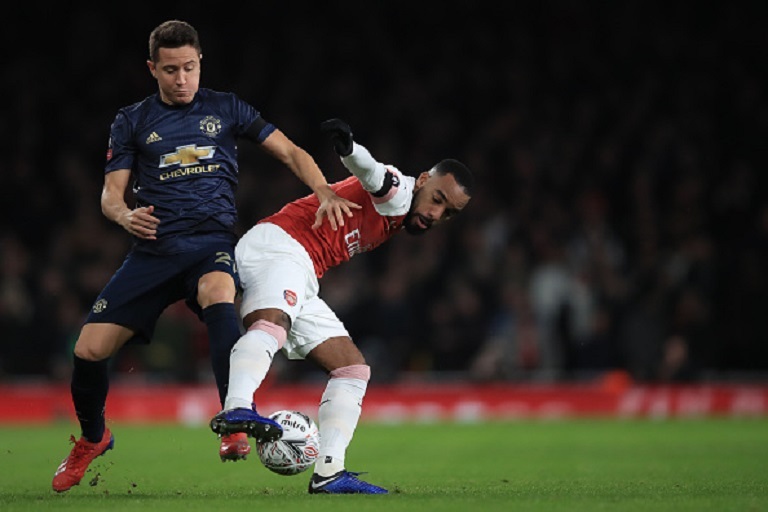   Andre Herrera of Manchester United in action with Alexandre Lacazette of Arsenal during the FA Cup Fourth Round match between Arsenal and Manchester United at Emirates Stadium on January 25, 2019 in London, United Kingdom.PHOTO/GETTY IMAGES