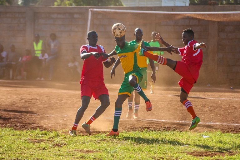   Semifinal action between Piuretto FC (Green) and Sinema FC (Red) at Umeme Grounds in Ziwani, Nairobi on December 28, 2018.PHOTO: BRIAN KINYANJUI