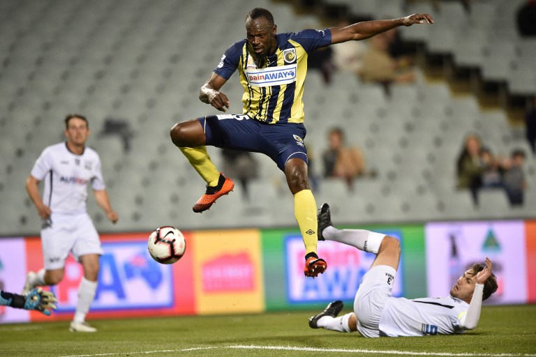 This file photo taken on October 12, 2018 shows Olympic sprinter Usain Bolt, playing for A-League football club Central Coast Mariners, jumping while controlling the ball in his first competitive start for the club against Macarthur South West United in Sydney.PHOTO/AFP