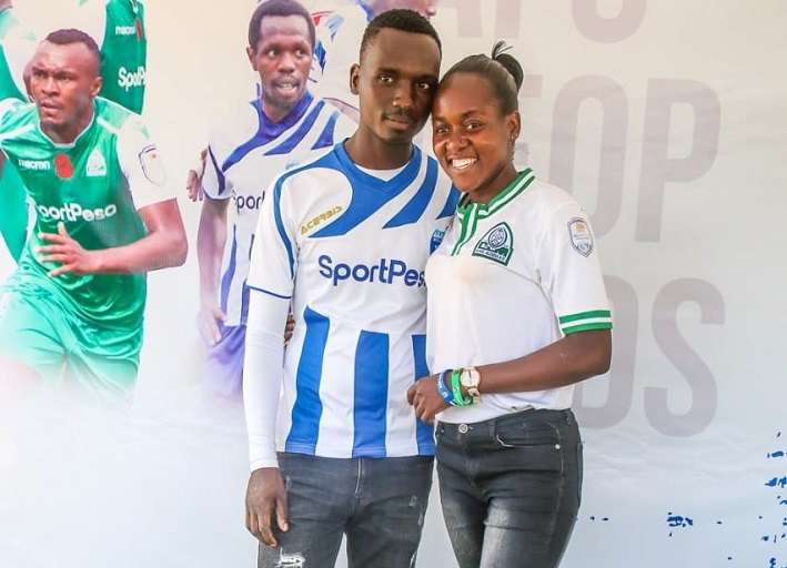   Valentine lucky couple Walter Kisanya and Dorcas Odhiambo takes photo with their favourite team jerseys at Kasarani Stadium in Nairobi on February 9, 2018.PHOTO/SPN