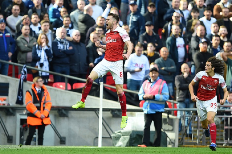  Aaron Ramsey of Arsenal celebrates after scoring his team's first goal during the Premier League match between Tottenham Hotspur and Arsenal FC at Wembley Stadium on March 02, 2019 in London, United Kingdom.PHOTO/GETTY IMAGES