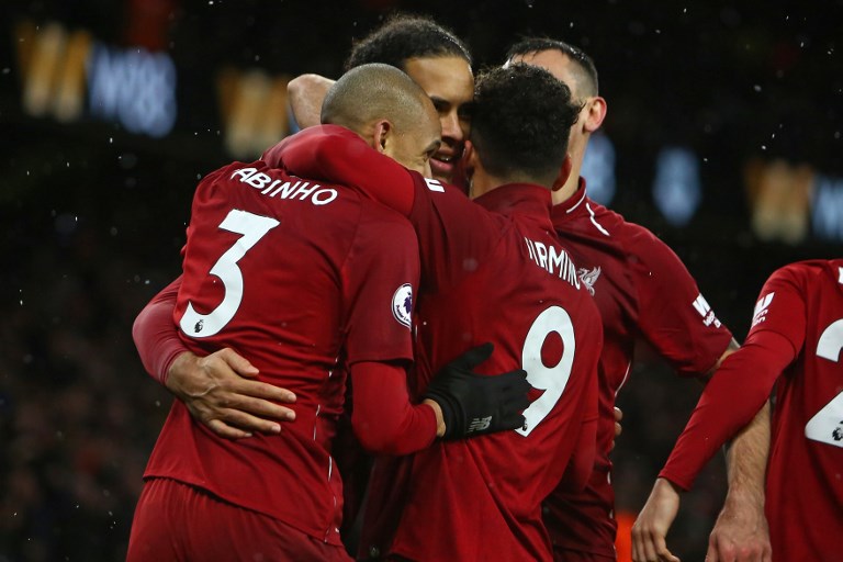  Add to cart Print Share this document Liverpool's Dutch defender Virgil van Dijk (C) celebrates with teammates after scoring their second goal during the English Premier League football match between Wolverhampton Wanderers and Liverpool at the Molineux stadium in Wolverhampton, central England on December 21, 2018.PHOTO/ AFP