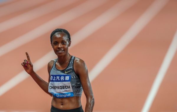 Beatrice Chepkoech of Kenya celebrates after the Women's 3000m Steeplechase of 2019 IAAF Diamond League in east China's Shanghai Municipality on May 18, 2019. Beatrice Chepkoech won the first place in a time of 9:04.53. PHOTO/AFP