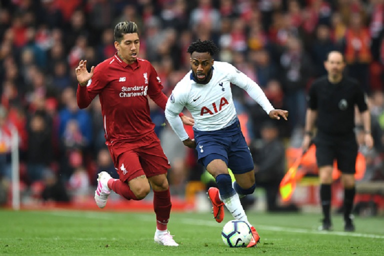 Danny Rose of Tottenham Hotspur is close down by Roberto Firminho of Liverpool during the Premier League match between Liverpool FC and Tottenham Hotspur at Anfield on March 31, 2019 in Liverpool, United Kingdom.PHOTO/ GETTY IMAGES