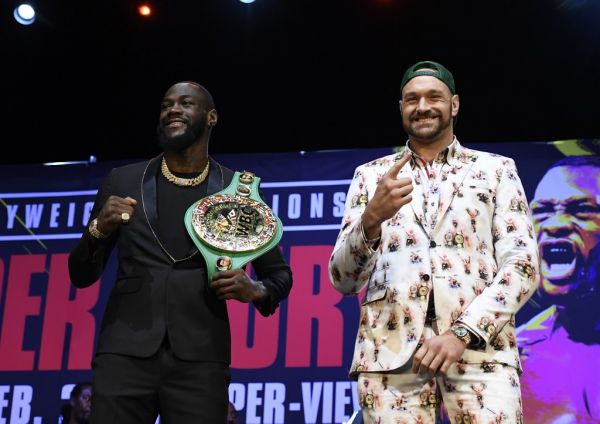 Deontay Wilder (L) and Tyson Fury get together during a news conference at The Novo Theater at L.A. Live on January 13, 2020 in Los Angeles, California. PHOTO | AFP