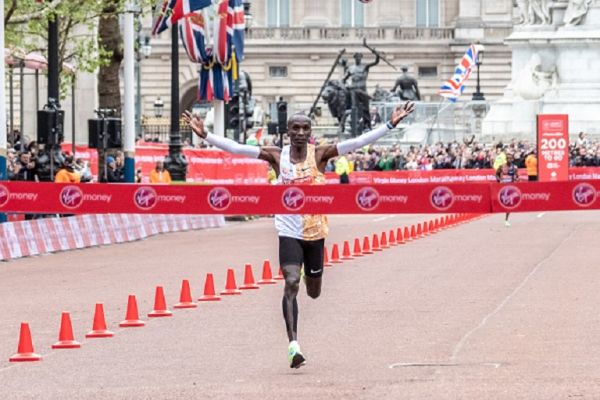 Eliud Kipchoge crosses the finishing line 1st and new course record during the 2019 Virgin Money London Marathon on April 28, 2019 London, England. PHOTO/ GETTY IMAGES