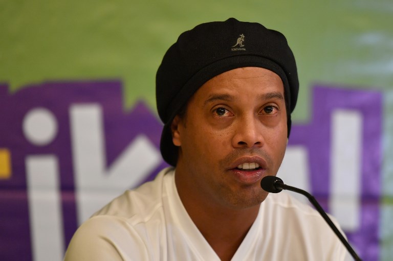  Former international football star, World Cup winner and double FIFA World Player of the Year, Brazil's Ronaldo de Assis Moreira, also known as “Ronaldinho Gaucho" waves during a press conference on November 9, 2018 in the Kenyan capital, Nairobi. PHOTO/AFP