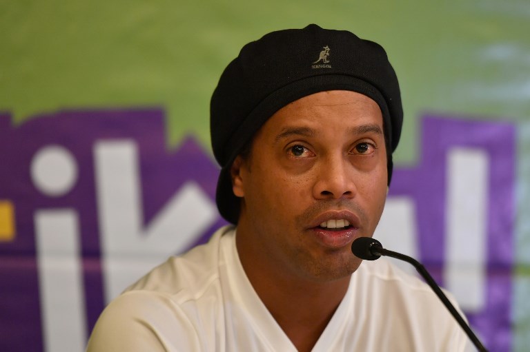 Former international football star, World Cup winner and double FIFA World Player of the Year, Brazil's Ronaldo de Assis Moreira, also known as “Ronaldinho Gaucho" waves during a press conference on November 9, 2018 in the Kenyan capital, Nairobi. PHOTO/AFP