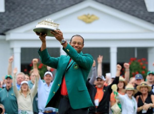  In this file photo taken on April 13, 2019 Tiger Woods of the United States wears The Green Jacket and holds The Masters Trophy after his historic one shot win during the final round of the 2019 Masters Tournament at Augusta National Golf Club on April 14, 2019 in Augusta, Georgia. PHOTO/AFP