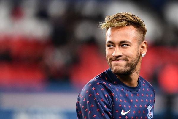  In this file photo taken on October 07, 2018 Paris Saint-Germain's Brazilian forward Neymar smiles during warm up prior to the French L1 football match between Paris Saint-Germain (PSG) and Olympique de Lyon (OL) at the Parc des Princes stadium in Paris. A Brazilian judge on August 9, 2019 dismissed the rape case against footballer Neymar citing insufficient evidence, court sources told AFP. The decision -- the final episode in the rape case against the Brazilian international superstar -- comes on the recommendations of prosecutors just over a month after police dropped the case citing lack of evidence. PHOTO | AFP