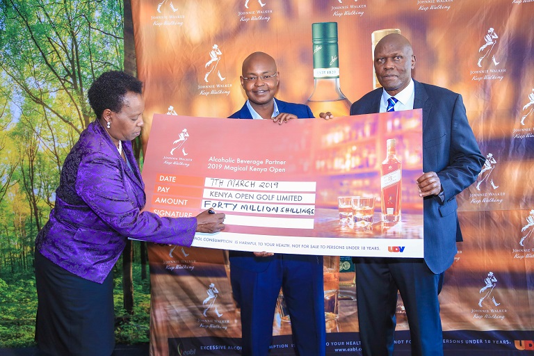  KBL Managing Director Jane Karuku (L) signs the sponsorship cheque to KOGL, as Director Joe Wangai (R) and KGU Vice chair Anthony Murage looks on in Nairobi on March 7, 2019. PHOTO/SPN