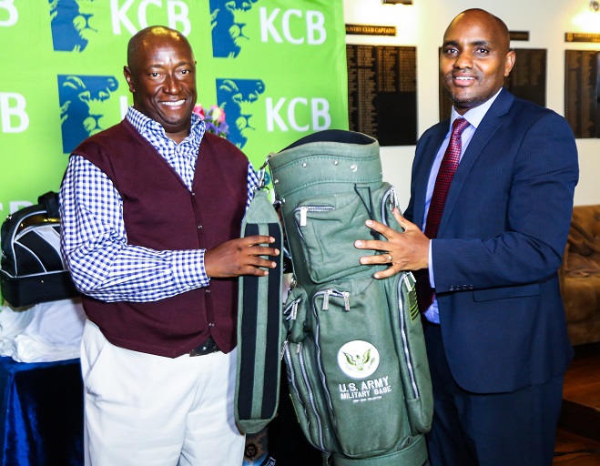  KCB Group Director Regional Business Mr. Paul Russo presents an award to Tony Chege, the  overall winner  of  KCB Sponsored club Nite  at the Karen Country Club on February 14, 2019.PHOTO/SPN