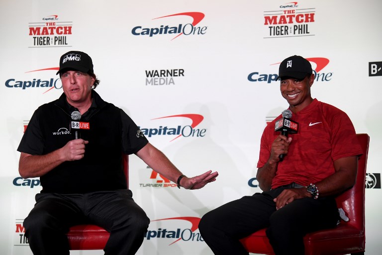 (L-R) Phil Mickelson and Tiger Woods speak with the media during a press conference before The Match at Shadow Creek Golf Course on November 20, 2018 in Las Vegas, Nevada.PHOTO/AFP