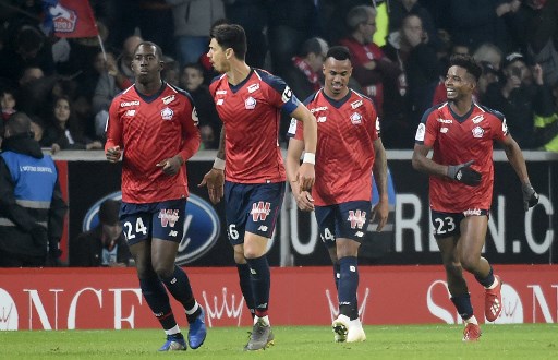  Lille's French midfielder Boubakary Soumare, Lille's Portuguese defender Jose Fonte, Lille's Brazilian defender Gabriel Dos Santos and Lille's Brazilian midfielder Thiago Mendes celebrate after scoring a goal during the French L1 football match between Lille (LOSC) and Paris Saint-Germain (PSG) on April 14, 2019, at the Pierre-Mauroy Stadium in Villeneuve d'Ascq, near Lille, northern France. PHOTO/AFP