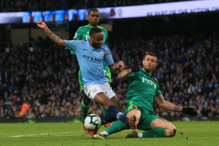 Manchester City's English midfielder Raheem Sterling (L) vies with Watford's Dutch defender Daryl Janmaat during the English Premier League football match between Manchester City and Watford at the Etihad Stadium in Manchester, north west England, on March 9, 2019. PHOTO/ AFP