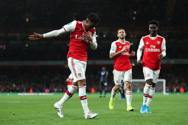 Reiss Nelson of Arsenal celebrates after scoring a goal to make it 4-0 during the Carabao Cup Third Round match between Arsenal and Nottingham Forest at Emirates Stadium on September 24, 2019 in London, England.PHOTO/ GETTY IMAGES