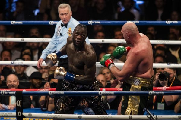Tyson Fury (R) in action against Deontay Wilder (L) during the 12th round of the WBC Heavyweight Championship at the Staples Center in Los Angeles, California on December 01, 2018. PHOTO | AFP