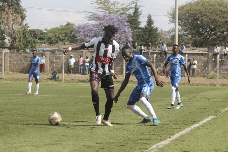  Ushuru forward Bill Oporia is closely kept in check by Nakumatt's Cornelius Juma during the first leg of the 2018 KPL Promotion playoff played on Friday October 19, 2018, at Camp Toyoyo.PHOTO/FKF