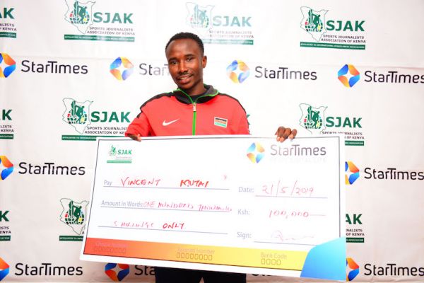  Vincent Mutai poses with his StarTimes/SJAK Sports Personality of the Month for April KSh100,000 dummy cheque in Nairobi on May 21, 2019. PHOTO/Courtesy