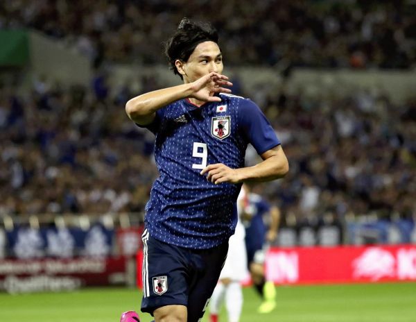 A file photo shows Japan's Takumi Minamino reacts after scoring an opener in the first half of the FIFA World Cup Qatar Asian Qualification Round 2 game against Mongolia at Saitama Stadium in Saitama Prefecture on Oct. 10, 2019. Minamino will transfer from Red Bull Salzburg to Liverpool after having a medical without any problem, according to British media reports. PHOTO | AFP
