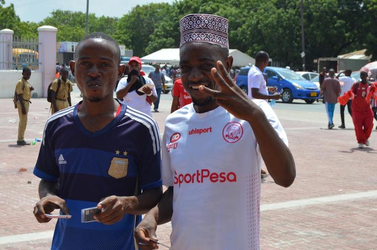 A Simba SC fan (right) displays the projected scoreline as he heads to the National Stadium, Dar-es-Salaam to watch his team take on JSS of Algeria in a CAF Champions League clash on January 12, 2019. PHOTO/Courtesy/Simba SC