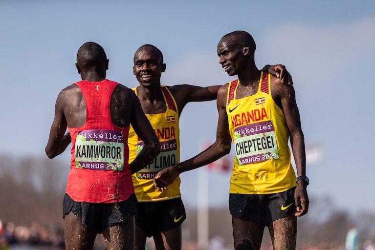 Aarhus 2019 World Cross Country champion, Joshua Cheptengei (right) and countryman Jacob Kiplimo commensurate with deposed two-time winner, Geoffrey Kipsang Kamworor who won bronze following the conclusion of the senior men 10km race in Denmark on Saturday, March 30, 2019. PHOTO/IAAF