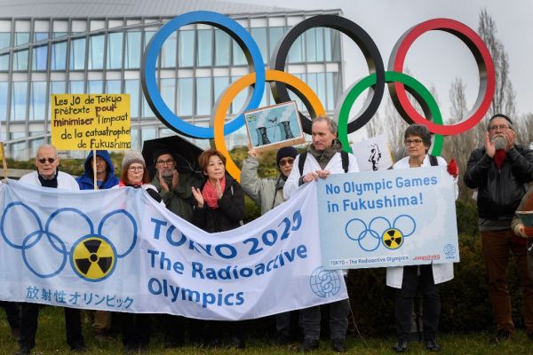 Activists stage a protest in front of the headquarters of the International Olympic Committee (IOC) against the holding of the Tokyo 2020 Olympic Games under the state of nuclear emergency, on February 26, 2020, in Lausanne. PHOTO | AFP