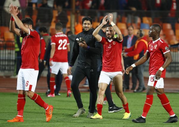 Ahly's defender Ali Maaloul (C-R) celebrates with team members after Ahly won the first leg of the CAF Champions League Quarter-final football match between Egypt's Al-Ahly and South Africa's Mamelodi Sundowns at Cairo International Stadium in the capital Cairo on February 29, 2020. PHOTO | AFP