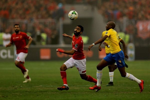 Al Ahly's Hussein Elshahat (L) controls the ball during the second leg of the CAF Champions League quarter final football match between Egypt's Al-Ahly and South Africa's Mamelodi Sundowns at the Borg El Arab Stadium in Borg El Arab, near Alexandria on April 13, 2019. PHOTO | AFP