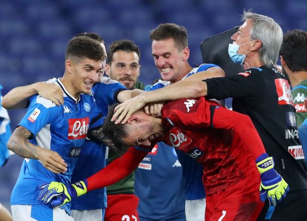 Alex Meret of Napoli celebrates with Arkadiusz Milik, Eljif Elmas, Piotr Zielinski, Giovanni Di Lorenzo and Dries Mertens after the penalties kicked at the end of the Coca Cola Italian Cup Final football match SSC Napoli v Fc Juventus at the Olimpico Stadium in Rome, Italy on June 17, 2020. PHOTO | AFP