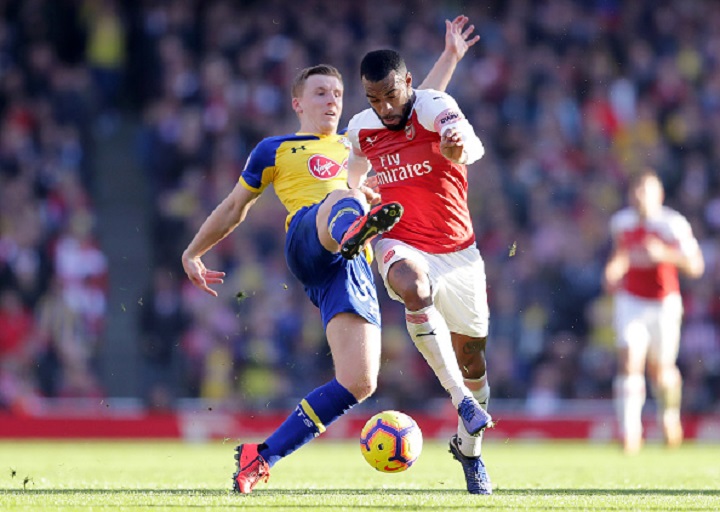 Alexandre Lacazette of Arsenal is challenged by Matt Targett of Southampton during the Premier League match between Arsenal FC and Southampton FC at Emirates Stadium on February 23, 2019 in London, United Kingdom. PHOTO/GettyImages
