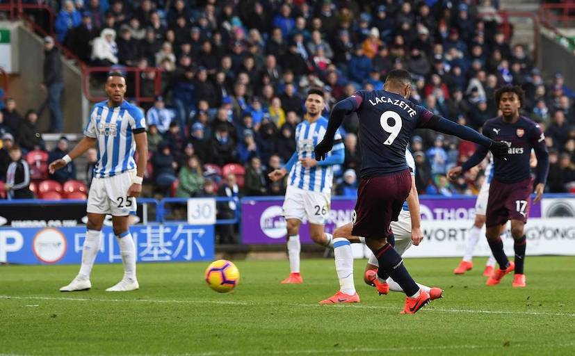 Alexandre Lacazette shoots to extend Arsenal FC's lead in their 2-1 victory at Huddersfield Town FC on Saturday, February 8, 2019. PHOTO/Arsenal FC