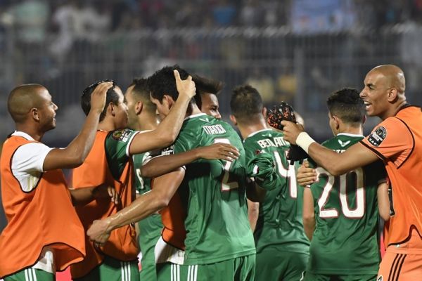 Algeria players celebrate after winning the 2019 Africa Cup of Nations (CAN) football match between Senegal and Algeria at the June 30 Stadium in Cairo on June 27, 2019. PHOTO | AFP