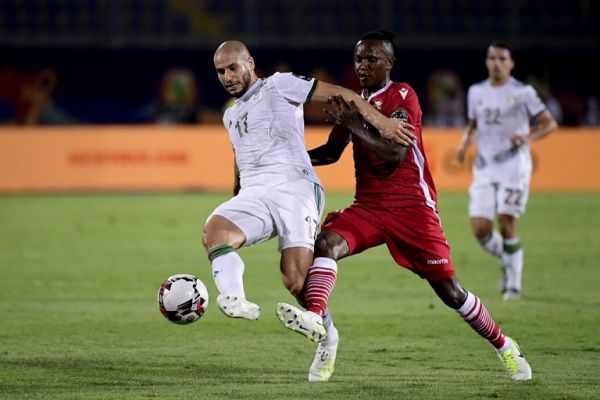 Algeria's midfielder Adlene Guedioura (L) fights for the ball with Kenya's midfielder Francis Kahata during the 2019 Africa Cup of Nations (CAN) football match between Algeria and Kenya at the 30 June Stadium in Cairo on June 23, 2019. PHOTO | AFP