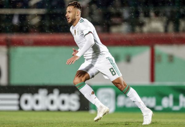 Algeria's Youcef Belaili celebrates scoring his side's third goal during the 2021 Africa Cup of Nations qualifying Group H soccer match between Algeria and Zambia at the Mustapha Tchaker Stadium. PHOTO | AFP