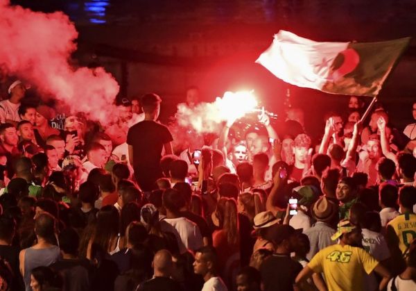 Algeria supporters celebrate after Algeria won the 2019 Africa Cup of Nations (CAN) semi-final football match against Nigeria, at the old harbour (vieux port) in Marseille, southern France, on July 14, 2019. PHOTO/AFP