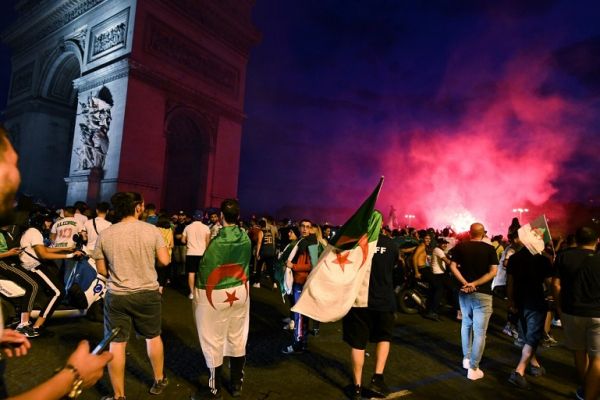 Algerian supporters celebrate near the Arc de Triomphe in Paris after the victory of their team during the 2019 Africa Cup of Nations (CAN) quarter final football match between Ivory Coast and Algeria, on July 11, 2019. PHOTO | AFP