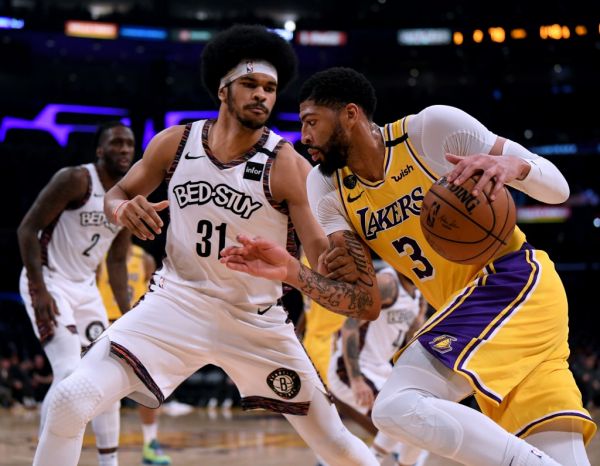 Anthony Davis #3 of the Los Angeles Lakers drives to the basket on Jarrett Allen #31 of the Brooklyn Nets during a 104-102 Nets win at Staples Center on March 10, 2020 in Los Angeles, California. PHOTO | AFP