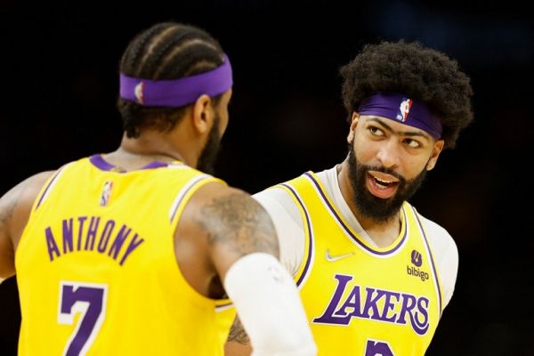 Anthony Davis #3 of the Los Angeles Lakers talks with Carmelo Anthony #7 during the second half of the NBA game against the Phoenix Suns at Footprint Center on April 05, 2022 in Phoenix, Arizona. PHOTO | AFP