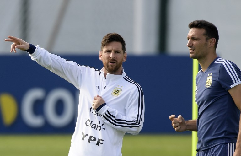 Argentina's forward Lionel Messi (L) gestures next to assistant coach Lionel Scaloni during a training session at the team's base camp in Bronnitsy, near Moscow, on June 11, 2018, ahead of the Russia 2018 World Cup football tournament. Argentina's coach Lionel Scaloni called up Lionel Messi to be back in the Argentinian squad on March 7, 2019, ahead of friendly football matches in preparation for the Copa America, to be held in Brazil on June and July 2019. PHOTO/AFP