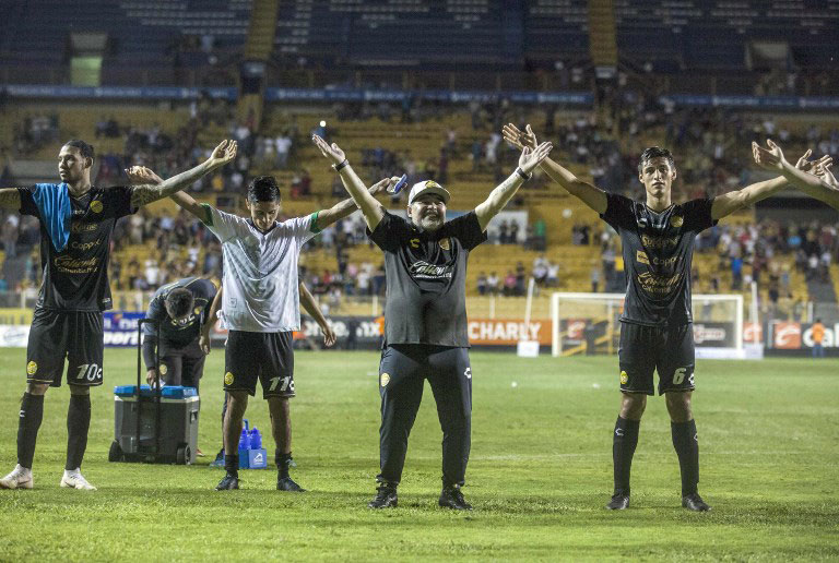 Argentine legend Diego Maradona (2-R) celebrates with his players during his first match as coach of Mexican second-division club Dorados, against Cafetaleros, at the Banorte stadium in Culiacan, Sinaloa State, Mexico, on September 17, 2018. PHOTO/AFP
