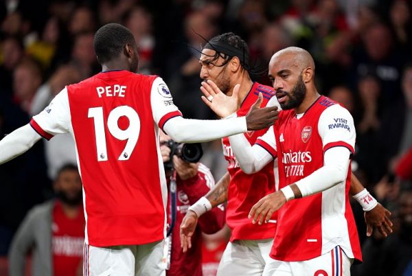 Arsenal's Alexandre Lacazette (right) celebrates with his team-mates after scoring their side's second goal of the game during the Premier League match at the Emirates Stadium, London. PHOTO | Alamy