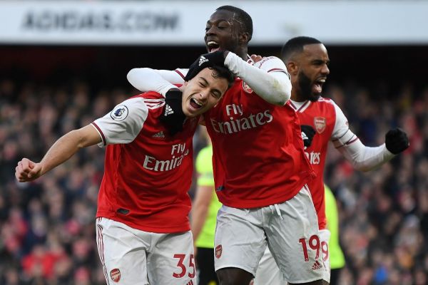 Arsenal's Brazilian striker Gabriel Martinelli (L) celebrates scoring the opening goal with Arsenal's French-born Ivorian midfielder Nicolas Pepe (C) and Arsenal's French striker Alexandre Lacazette during the English Premier League football match between Arsenal and Sheffield United at the Emirates Stadium in London on January 18, 2020. PHOTO | AFP