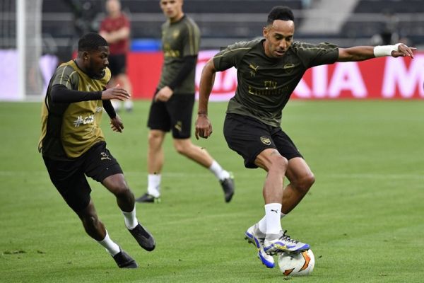 Arsenal's English midfielder Ainsley Maitland-Niles and Arsenal's Gabonese striker Pierre-Emerick Aubameyang (R) attend a training session at the Baku Olympic Stadium in Baku on May 28, 2019 on the eve of the UEFA Europa League final football match between Chelsea and Arsenal. PHOTO | AFP