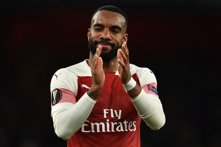 Arsenal's French striker Alexandre Lacazette applauds supporters on the pitch after the UEFA Europa League semi final, first leg, football match between Arsenal and Valencia at the Emirates Stadium in London on May 2, 2019. Arsenal won the game 3-1. PHOTO/AFP