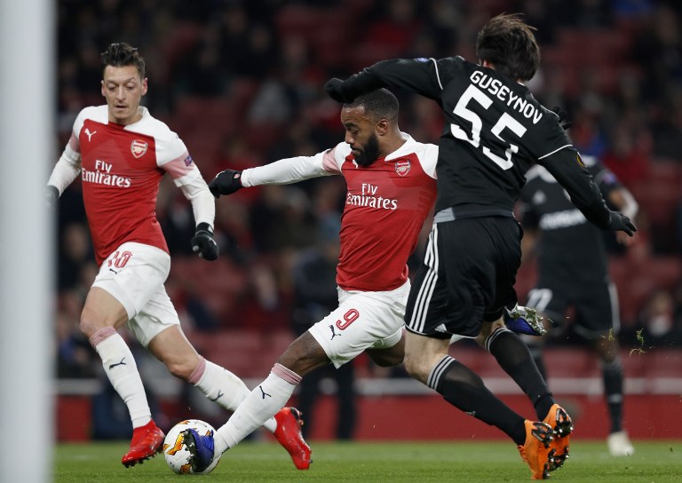 Arsenal's French striker Alexandre Lacazette scores the opening goal during their UEFA Europa league Group E football match between Arsenal and FK Qarabag at the Emirates stadium in London on December 13, 2018.PHOTO/AFP