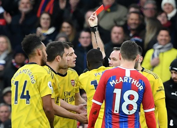 Arsenal's Gabonese striker Pierre-Emerick Aubameyang (L) is given a red card during the English Premier League football match between Crystal Palace and Arsenal at Selhurst Park in south London on January 11, 2020. PHOTO | AFP